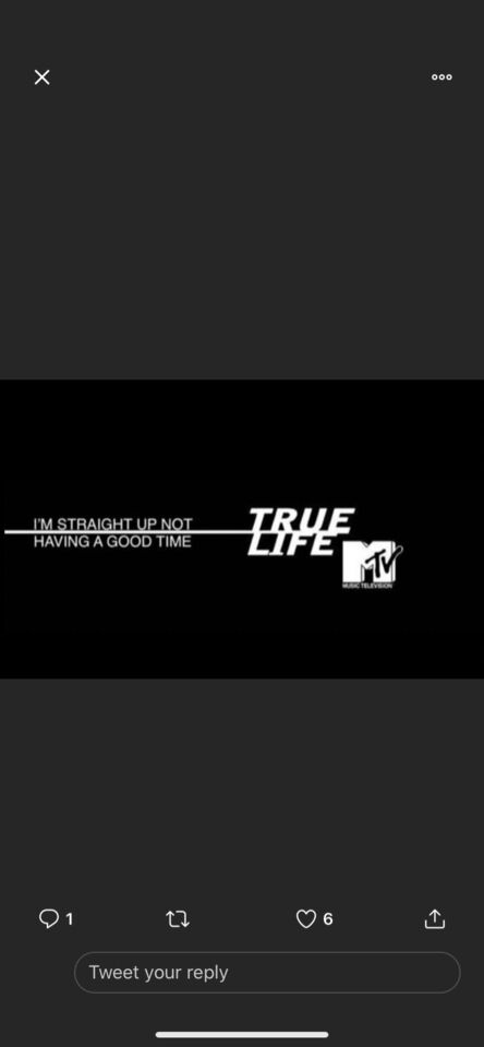 a close up of a cell phone with a black background; retro MTV as meme 