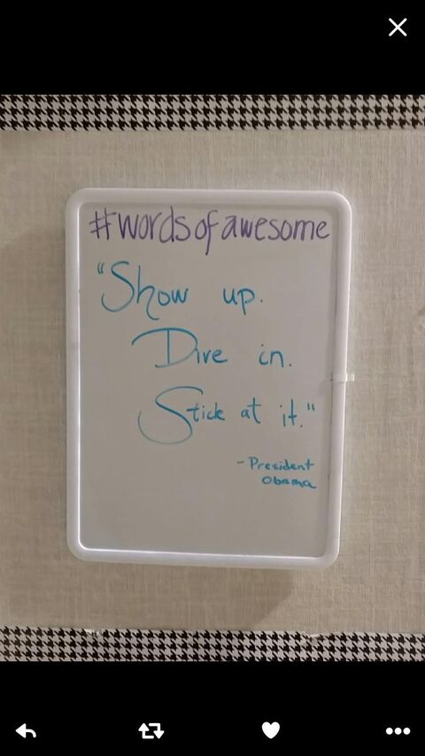 someone wrote a note on a white board with a blue marker