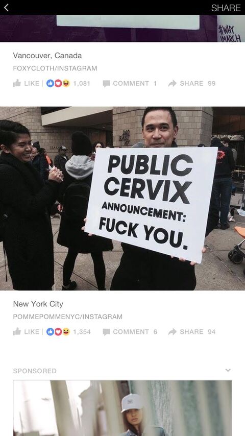 a close up of a person holding a protest sign in a crowd "public cervix" announcement