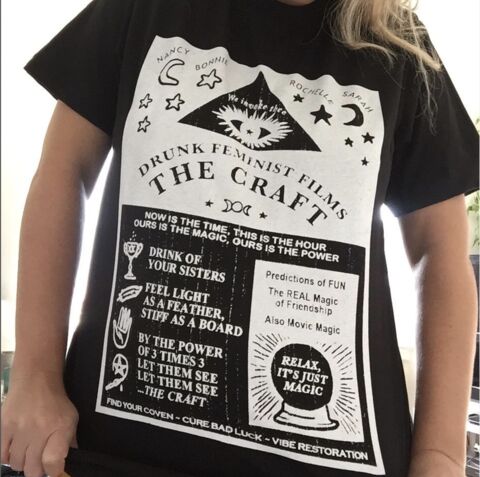 woman wearing a black shirt with a white and black graphic